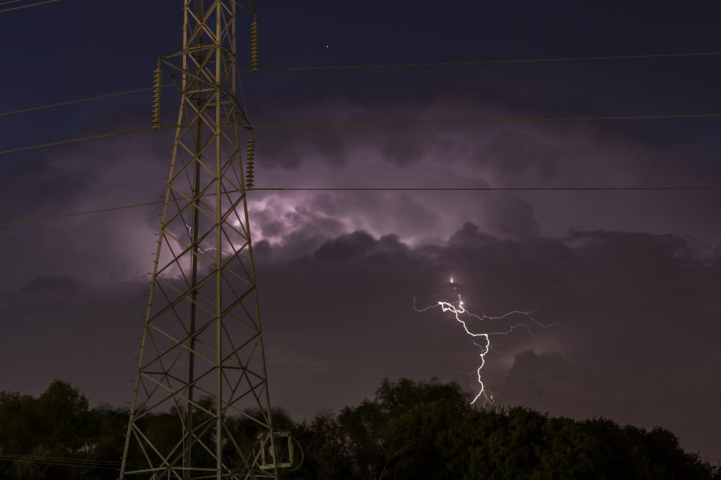 Austin, TX - The storm is coming... Photo of lightning in a purple dark sky